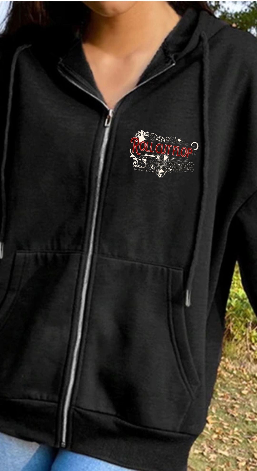 Woman wearing Roll Cut Flop Cornhole™ Unisex Black Zip-Up Hoodie Sweatshirt - Steampunk Vintage Red Scroll Logo